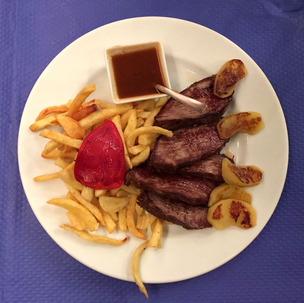 Presa ibérica con manzana